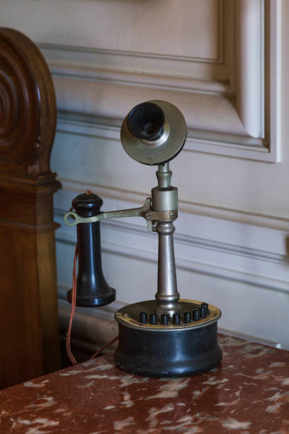 istock Antique Telephone on an Old Table 897504268
