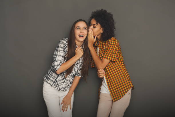 istock Young woman telling her friend some secrets 897508658