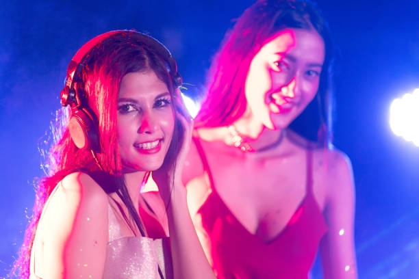 istock Cheering crowd young people at New Year - holiday celebration background 897512046