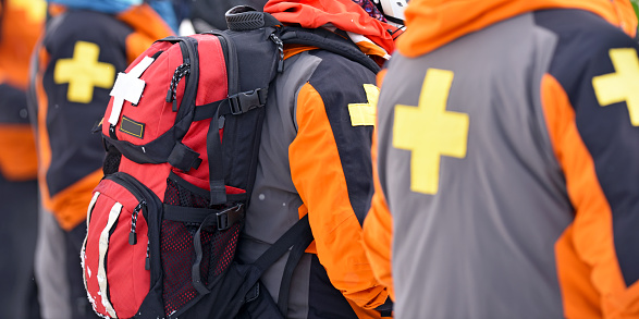 First aid ski patrol with backpacks and gear. Alberta, Canada.