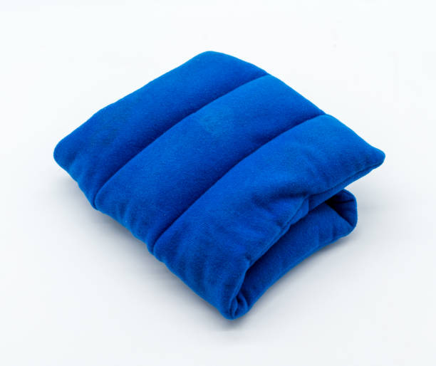 istock Blue microwave heating pad isolated on white background. Cold and hot wrap for shoulder,  neck, back, and body pain relief therapy. 897515812