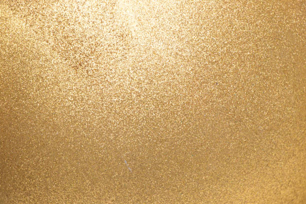 Closed up of metallic gold glitter textured background
