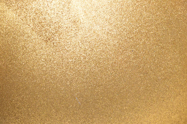 Closed up of metallic gold glitter textured background Closed up of metallic gold glitter textured background spark singer stock pictures, royalty-free photos & images