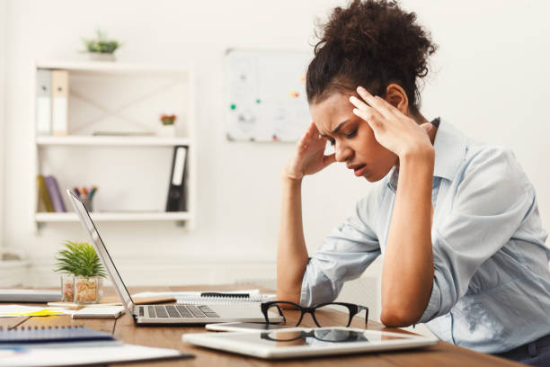 istock Tired business woman at office copy space 897524900