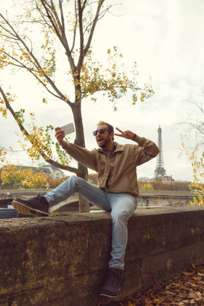 istock Modern guy using cellphone in the European city. 897528104