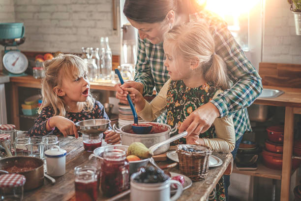istock Preparing Homemade Strawberry Jam and Canning in Jars 897535874