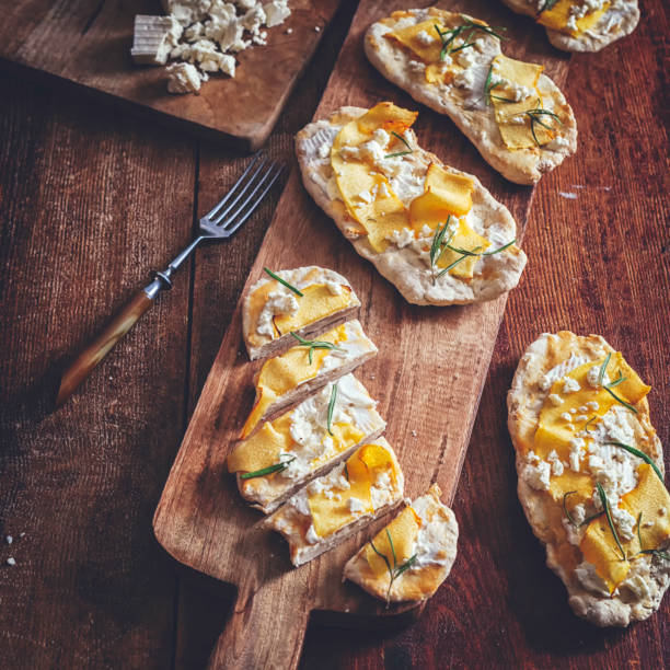 istock Crispbread with Serrano Ham, Cottage Cheese, and Figs 897536144