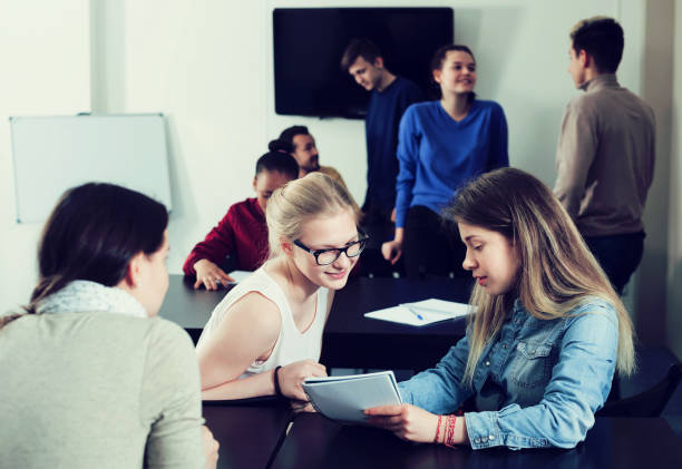 istock Girl consulting fellow student 897541348