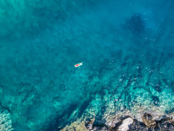 istock Woman on the sea 897547308