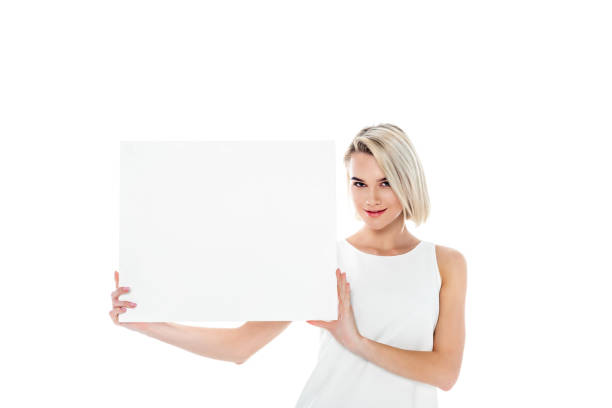 istock beautiful blonde girl with blank board, isolated on white 897557950