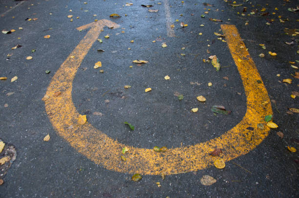 U-turn sign on concrete street