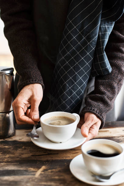 istock Person serving cups of coffee 897561160