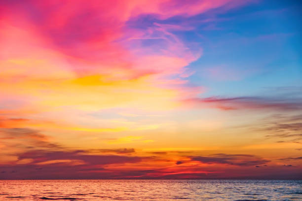 Tropical colorful dramatic sunset in Thailand Tropical colorful dramatic sunset with cloudy sky . Evening calm on the Gulf of Thailand. Bright afterglow. romantic sky stock pictures, royalty-free photos & images
