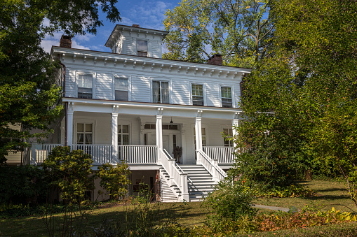 Historical Colonial House with White Clapboard Exterior and Blue Sky, Nyack, Rockland County, Hudson Valley, New York. Canon EOS 6D (full frame sensor). Polarizing filter.