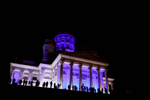 istock People stant in front of illuminated Helsinki St Nicholas cathed 897584286