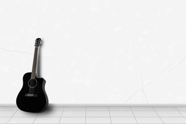 istock Home interior -  Black guitar in front of white wall 897599056