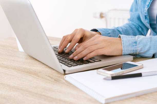 istock Close up of a hands busy typing on a laptop 897599292