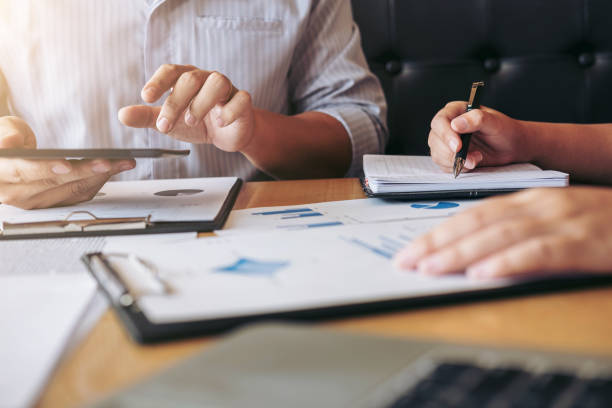 istock Young businessteam working with new startup project. discussing the charts and graphs showing the results at meeting. Business accounting and financial concept 897602708