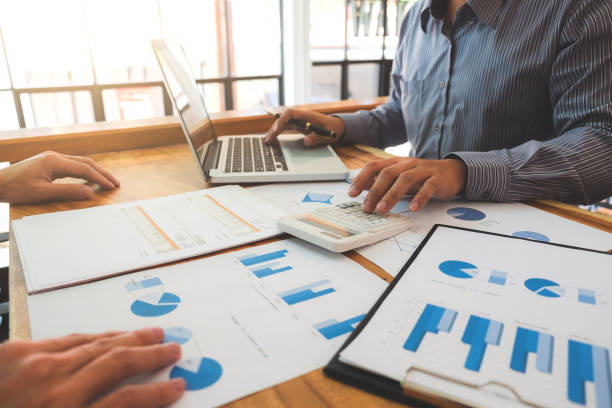 istock Business team meeting working with new startup project, discussion and analysis data the charts and graphs. Digital tablet calculator, laptop computer using, Business finances and accounting concept 897604494