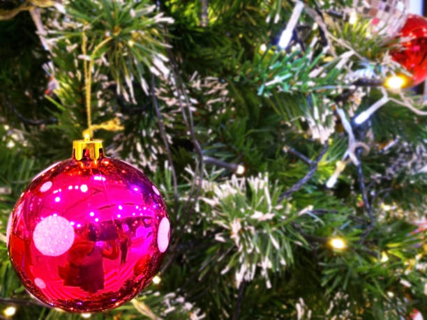 istock Blurred background, beautiful pink shiny ball is decorated on artificial tree, for happiness event such as Christmas and New Year festival. Copy space. 897604566