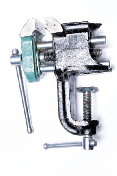 istock Metal table vise clamp with open jaws isolated on white 897605198