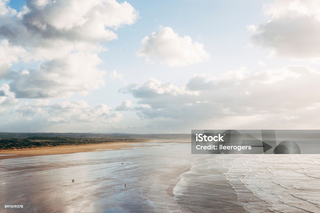 Saunton Sands beach on the coast of North Devon, England Saunton Sands beach on the North coast of Devon in South West England. Braunton Burrows sand dunes can be seen behind the beach. The beach is close to the towns of Braunton and Barnstaple. Barnstaple Stock Photo