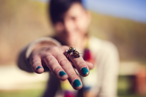Bee Landed On Girl's Hand