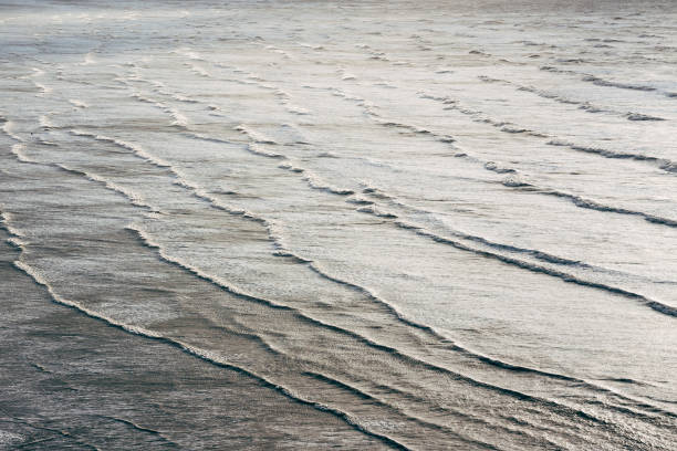 istock Waves rolling into Saunton Sands beach on the coast of North Devon, England 897633488