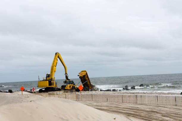 istock The dump truck unloads stones 897633608