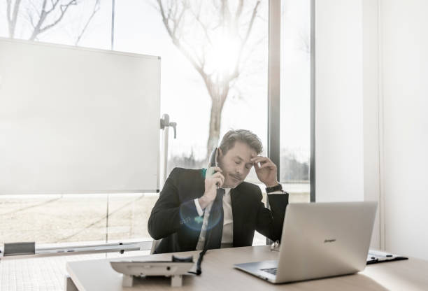 istock Worried businessman working in the office 897639446