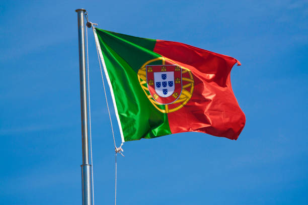 istock Flag Portugal on blue sky background. 897642514