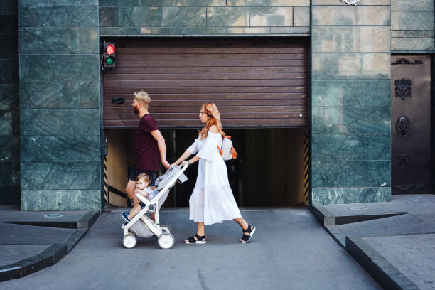 istock man and woman with a stroller 897646972