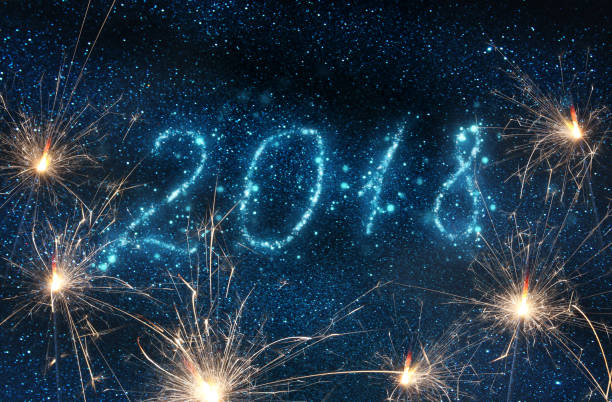 istock Happy New Years 2018 with glitter lights background. de-focused. 897660844