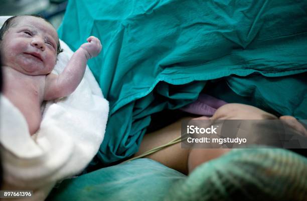 Newborn Child Seconds And Minutes After Birth Stock Photo - Download Image Now - Caesarean Section, Labor - Childbirth, Baby - Human Age