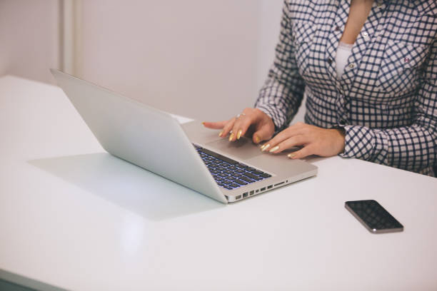 istock Close-up of girl hands while surfing on internet. 897661736