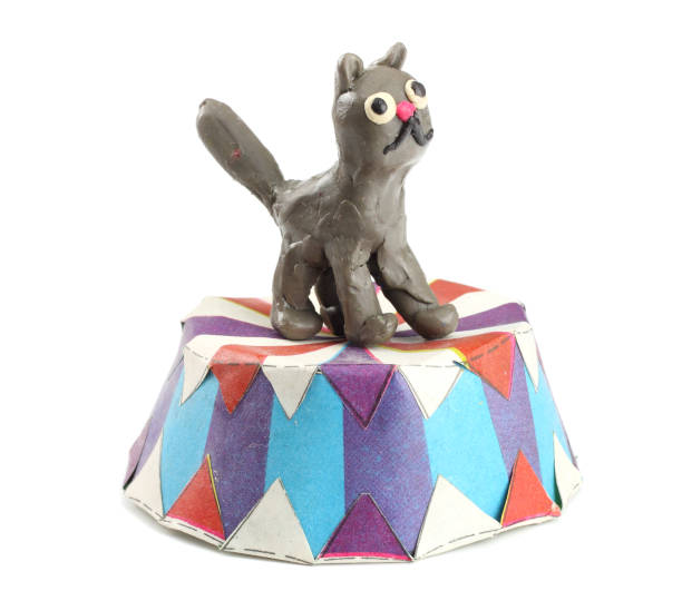 istock Kid's modelling clay cat isolated on white background 897665026