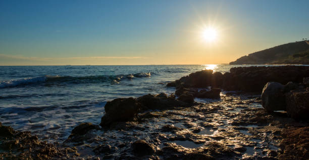 istock The calm sea in a very cloudy sunset 897668012