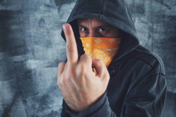 istock Hooded gang member criminal 897668150