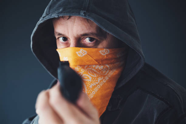 istock Hooded gang member criminal 897668162