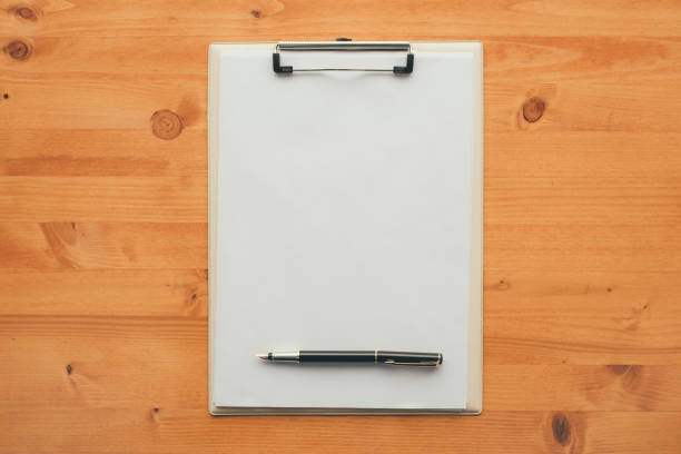 istock Overhead view of blank clipboard note pad paper 897668626