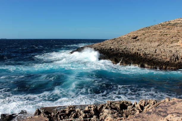istock Maritime landscape: Cliffs and coastline around the Blue Grotto, Malta. Strong swell 897670974