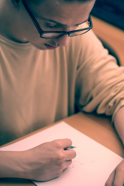 istock Young artist drawing at home 897671738