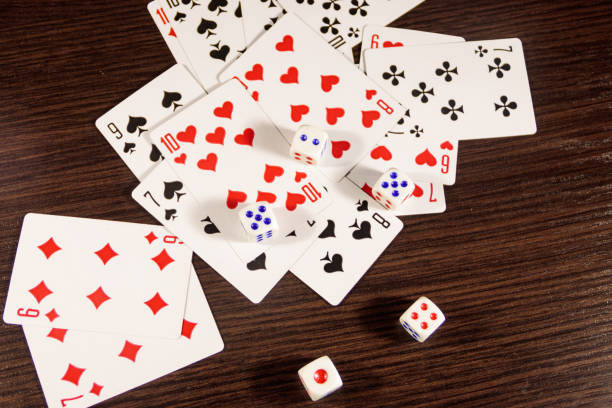 istock Playing cards and dice on a table. Game concept 897683892