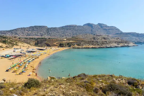 Beachgoers enjoy the lovely water in Greece