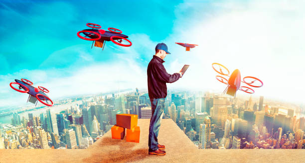 istock Delivery person sends off drones with packages from skyscraper in future city 897703380