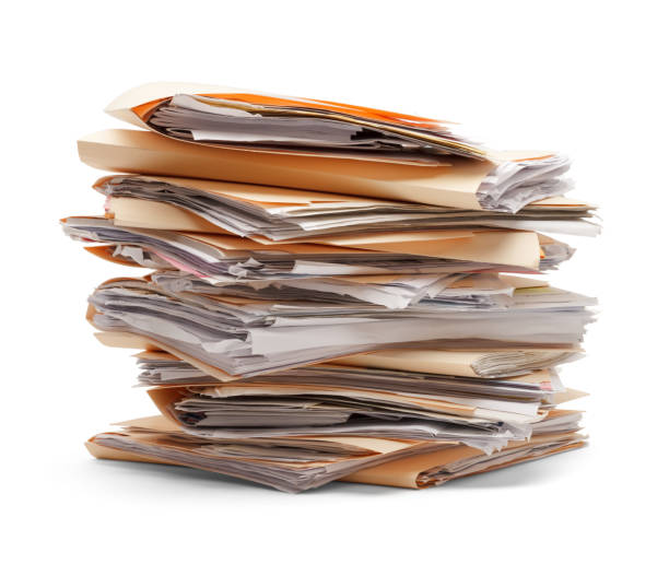 Files Stacked Files stacking up in a messy order isolated on white background. bureaucracy photos stock pictures, royalty-free photos & images