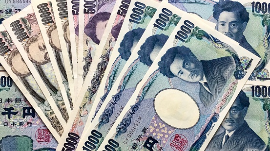 Money: spread of large denominations of Japanese yen currency used for travel in Japan