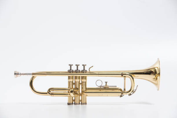 istock Gold lacquer trumpet with mouthpiece isolated on white 897714564