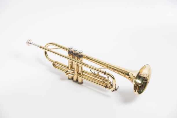 istock Gold lacquer trumpet with mouthpiece isolated on white 897714578