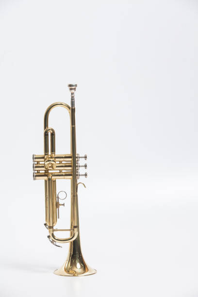 istock Gold lacquer trumpet with mouthpiece isolated on white 897714582